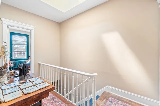 a view of a hallway with a window