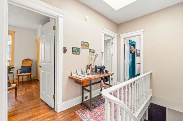 a view of a hallway with seating area