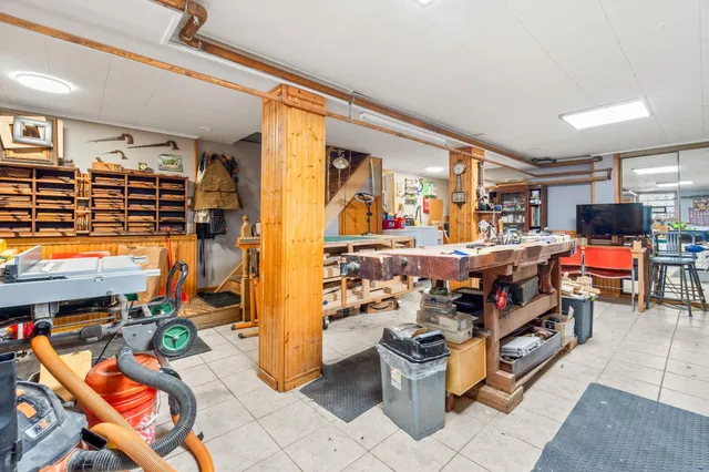 a living room filled with furniture and a flat screen tv