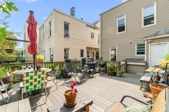 a view of a chairs and table in patio