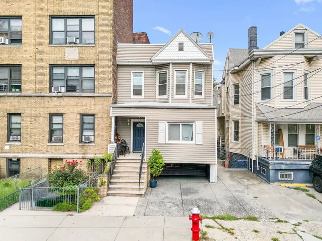 a front view of a building with many windows