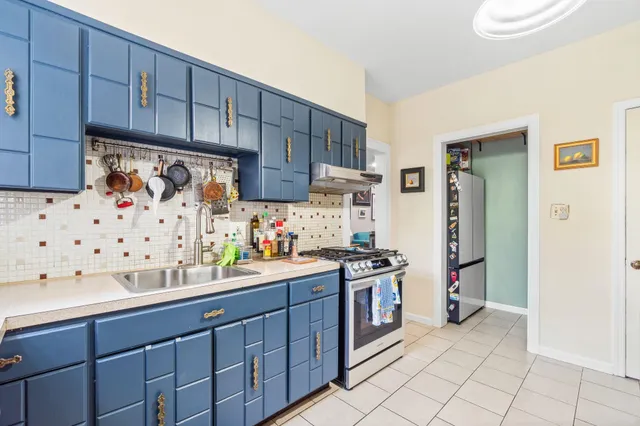a kitchen with granite countertop cabinets and steel stainless steel appliances
