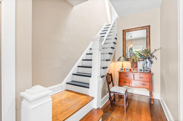 a view of a room with wooden floor and windows