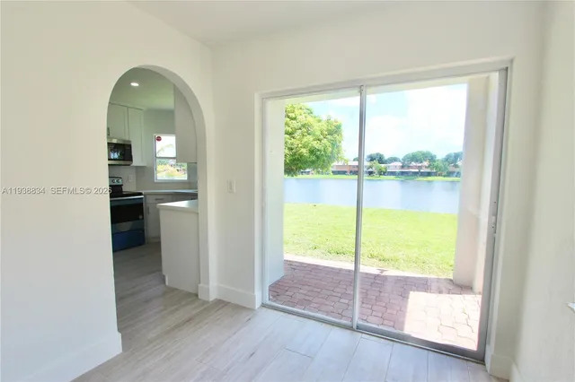 a view of a room that has a bed