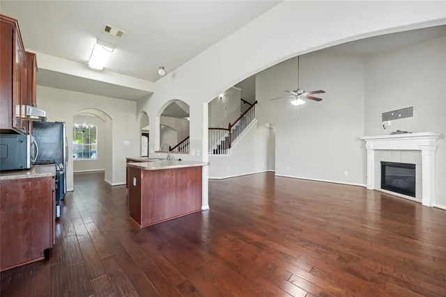 a living room with furniture and a fireplace