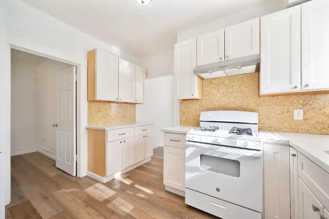 a utility room with cabinets a washer and dryer