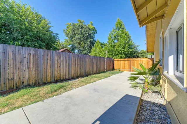a house view with a backyard space