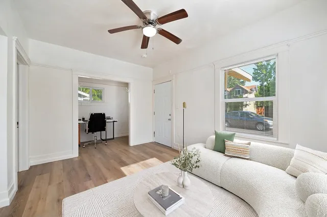 a living room with furniture and window