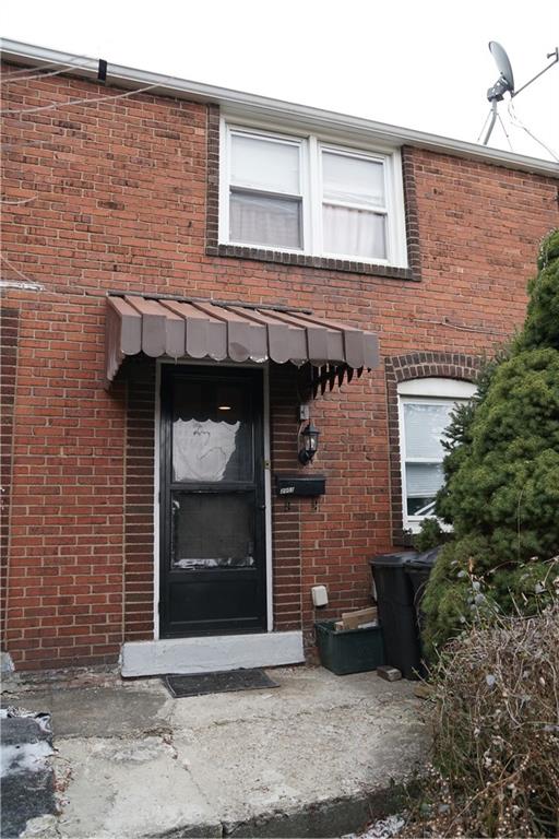 2003 Lafayette Street Pittsburgh, PA 15218 - Photo 1 of 12 a front view of a house with yard