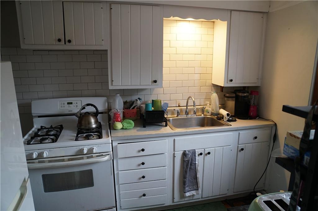 2003 Lafayette Street Pittsburgh, PA 15218 - Photo 4 of 12 a kitchen with cabinets appliances and a window