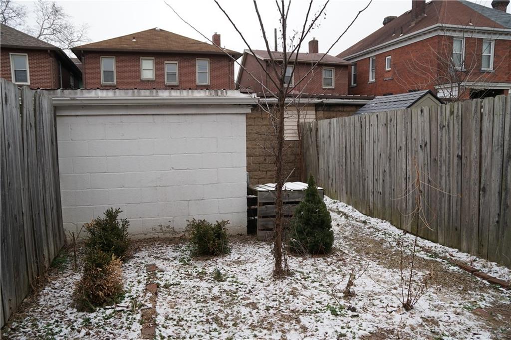 2003 Lafayette Street Pittsburgh, PA 15218 - Photo 10 of 12 a view of a house with a yard and wooden fence