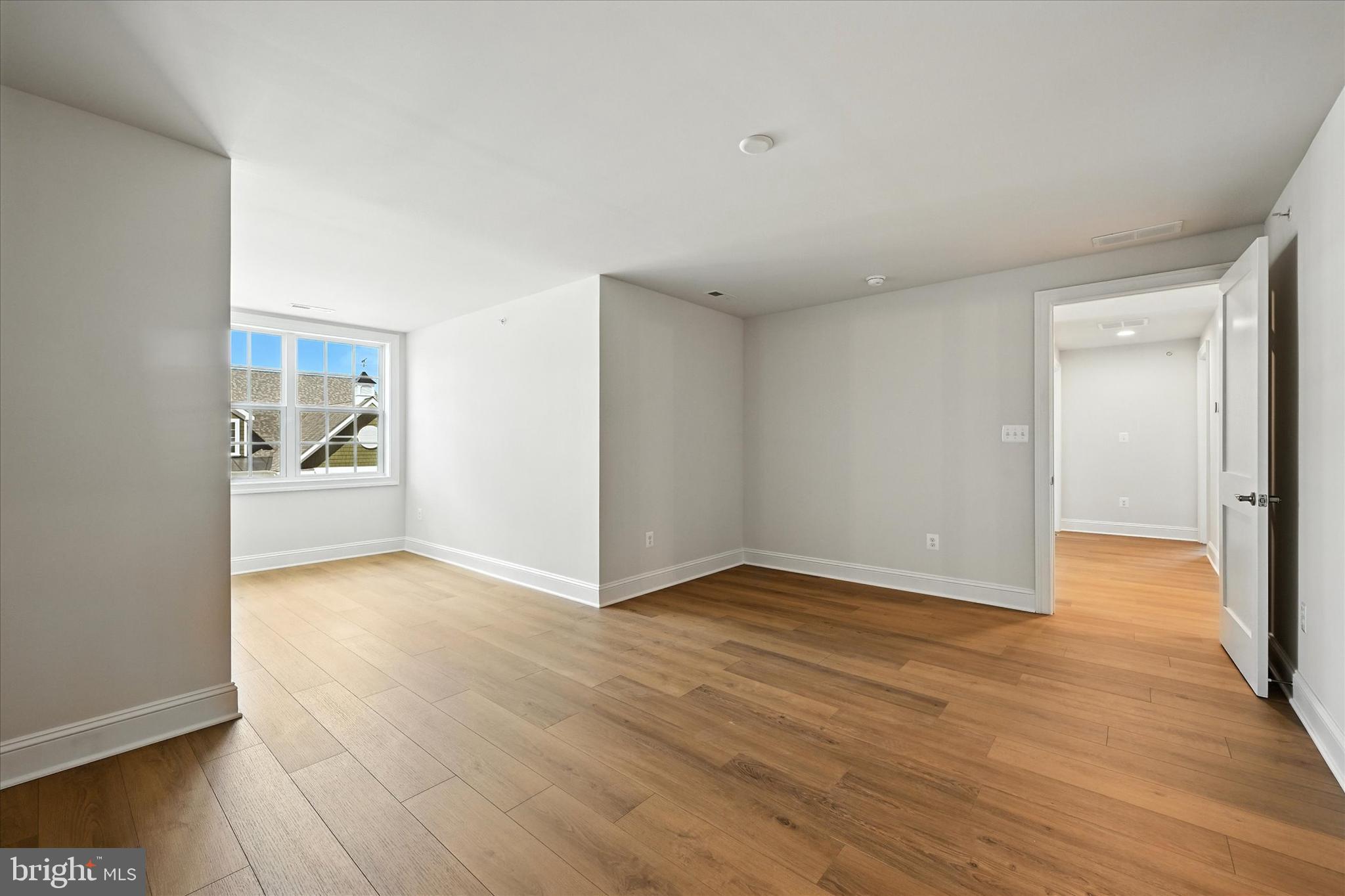 106 Villabrook Way Baltimore, MD 21212 - Photo 27 of 60 a view of an empty room and wooden floor