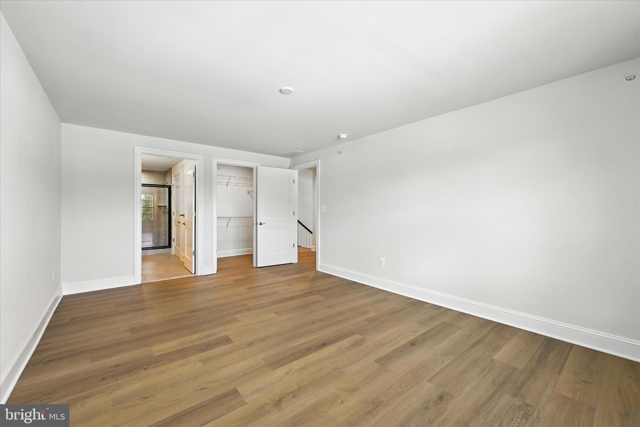 106 Villabrook Way Baltimore, MD 21212 - Photo 29 of 60 a view of an empty room with wooden floor and closet