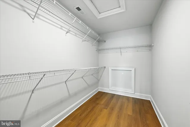 a spacious bathroom with a double vanity sink and mirror