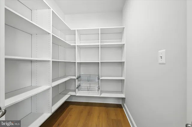 a bathroom with a sink toilet vanity and shower