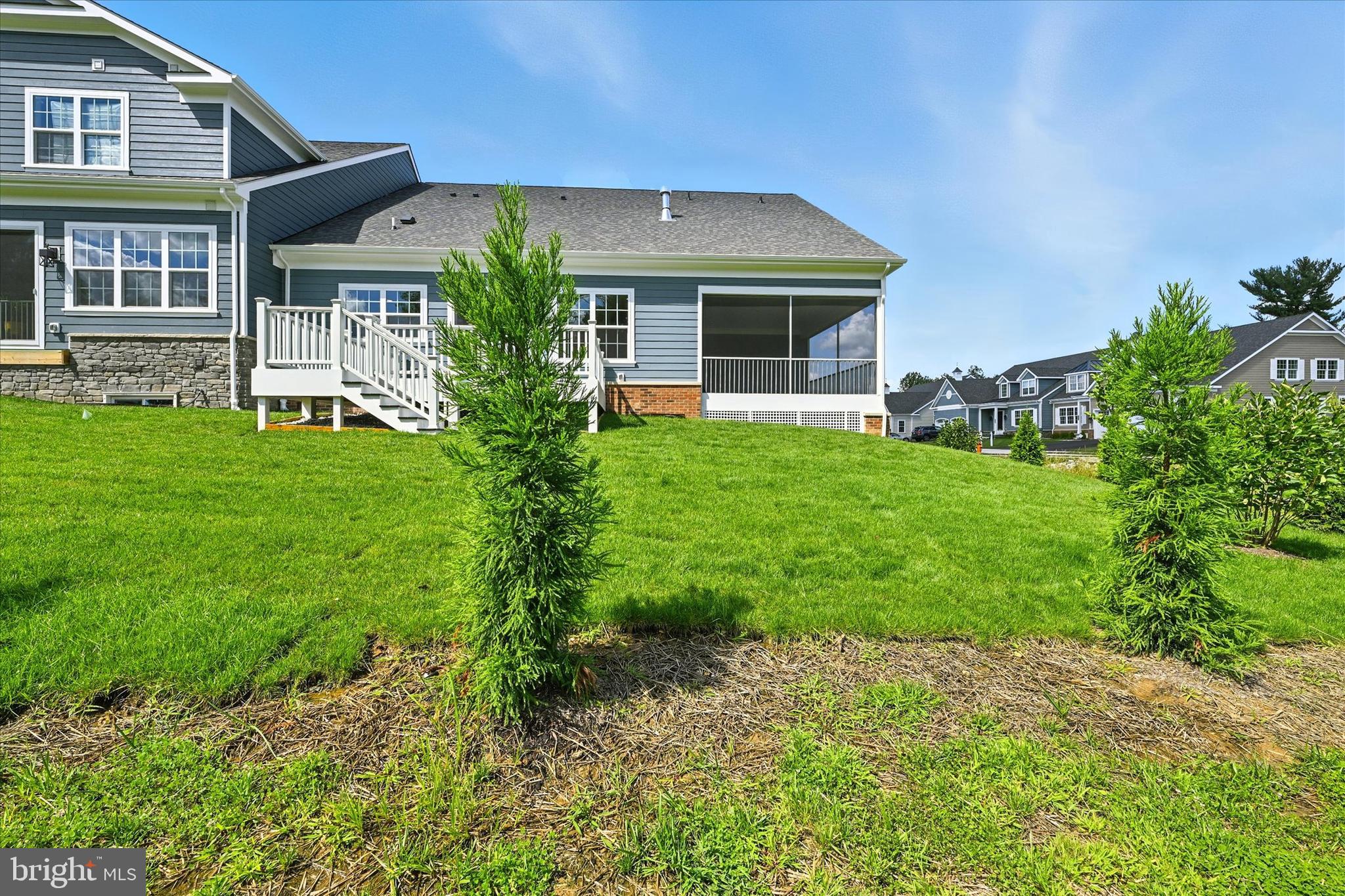 106 Villabrook Way Baltimore, MD 21212 - Photo 54 of 60 a front view of a house with a yard and porch