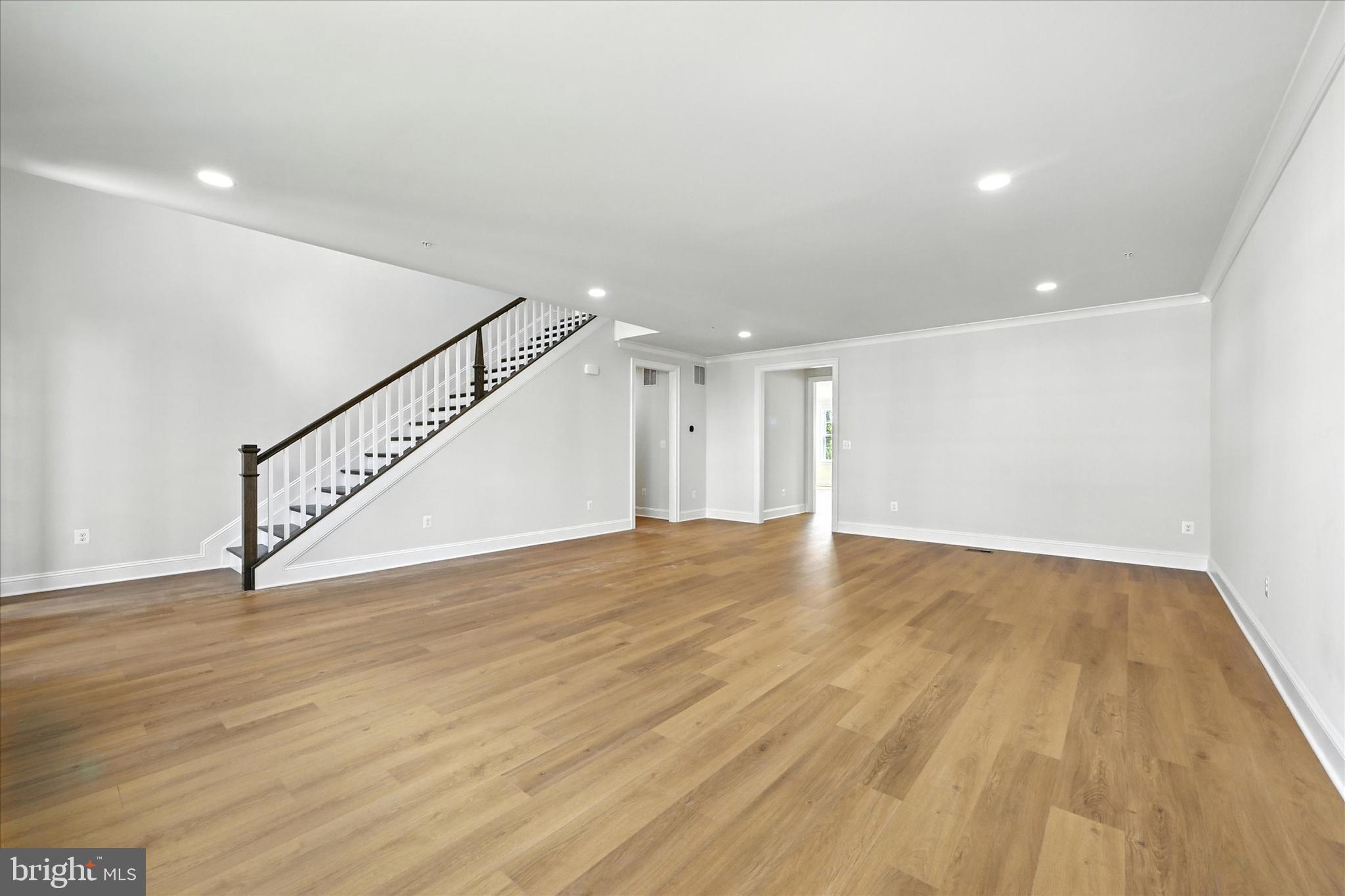 106 Villabrook Way Baltimore, MD 21212 - Photo 6 of 60 a view of an empty room with wooden floor