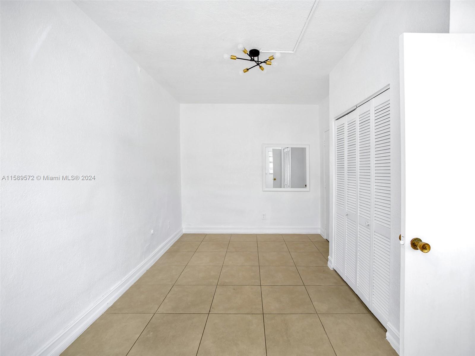 265 East 7th Street Hialeah, FL 33010 - Photo 13 of 28 a view of an empty room