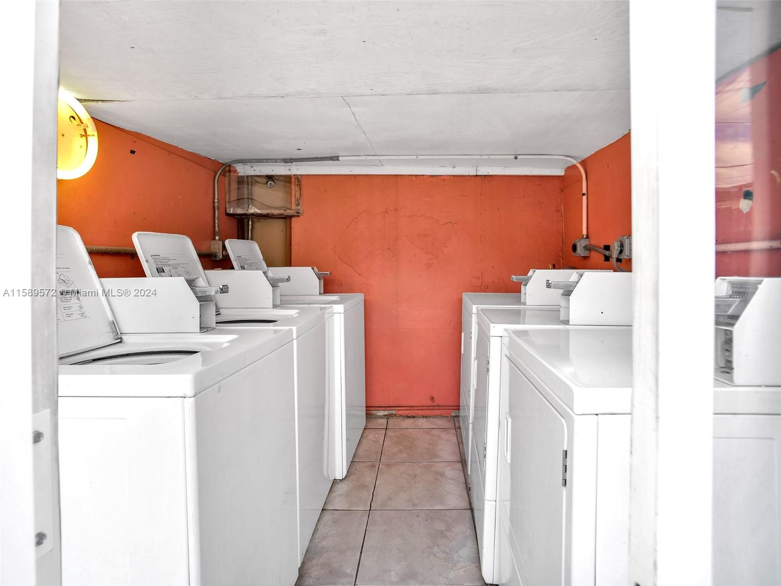 265 East 7th Street Hialeah, FL 33010 - Photo 28 of 28 a utility room with dryer and washer