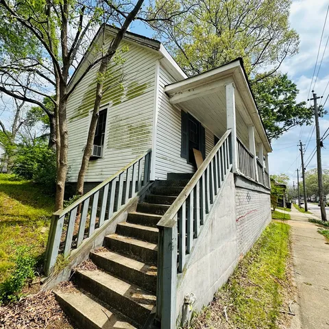 a view of a house with wooden stairs