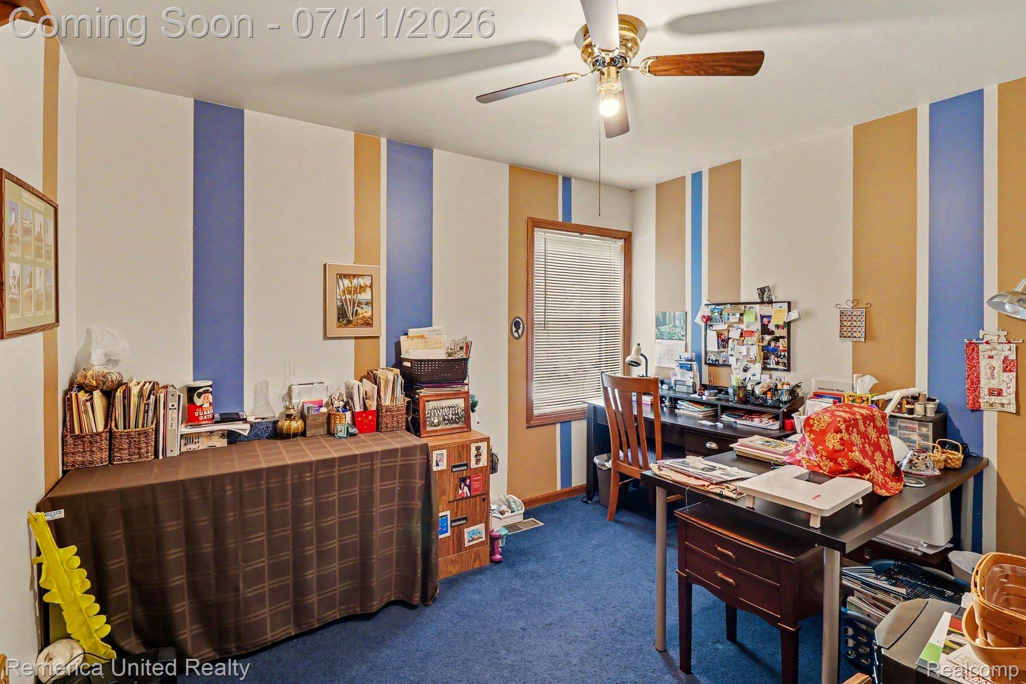 136 Endicott Howell, MI 48843 - Photo 15 of 28 Room featuring blue carpeting and walls with vertical stripes