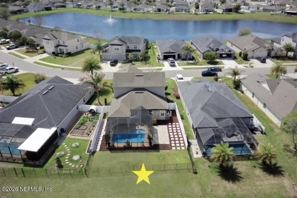 115 Sierras Loop St. Augustine, FL 32086 - Photo 4 of 65 an aerial view of a house with a garden and lake view