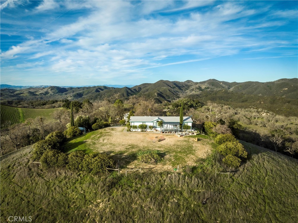 9308 Chimney Rock Road Paso Robles, CA 93446 - Photo 2 of 8 a view of a lake with mountains in the background