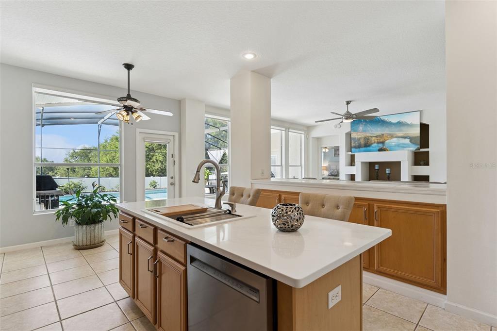 13319 Via Roma Circle Clermont, FL 34711 - Photo 11 of 43 a kitchen with a sink and a stove