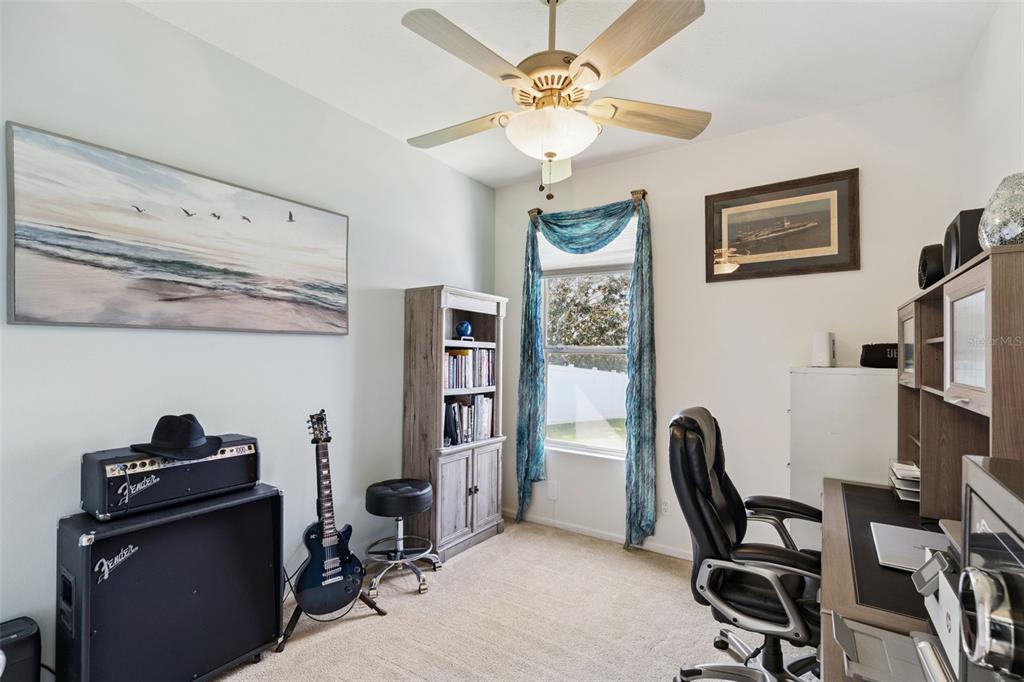 13319 Via Roma Circle Clermont, FL 34711 - Photo 26 of 43 a view of a workspace with furniture and a window
