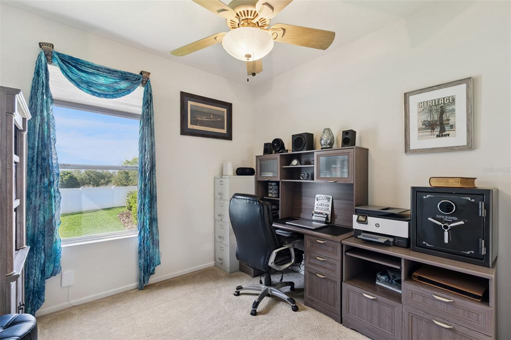 13319 Via Roma Circle Clermont, FL 34711 - Photo 27 of 43 a view of a workspace with furniture and a window