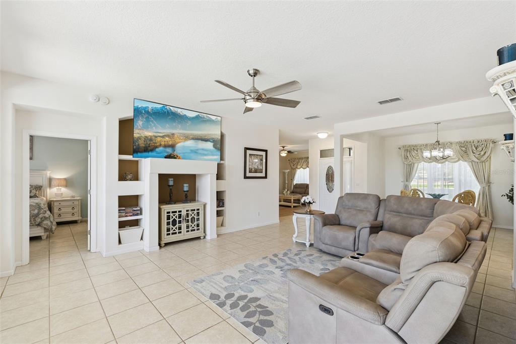 13319 Via Roma Circle Clermont, FL 34711 - Photo 4 of 43 a living room with furniture and a ceiling fan