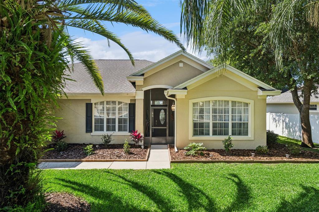 13319 Via Roma Circle Clermont, FL 34711 - Photo 43 of 43 a front view of house with yard and green space