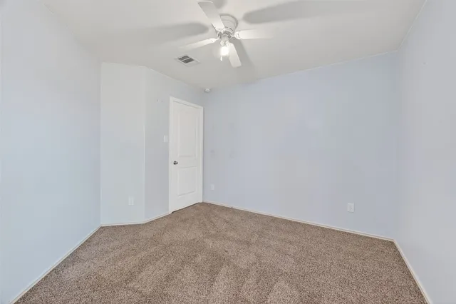 a view of a big room with carpet