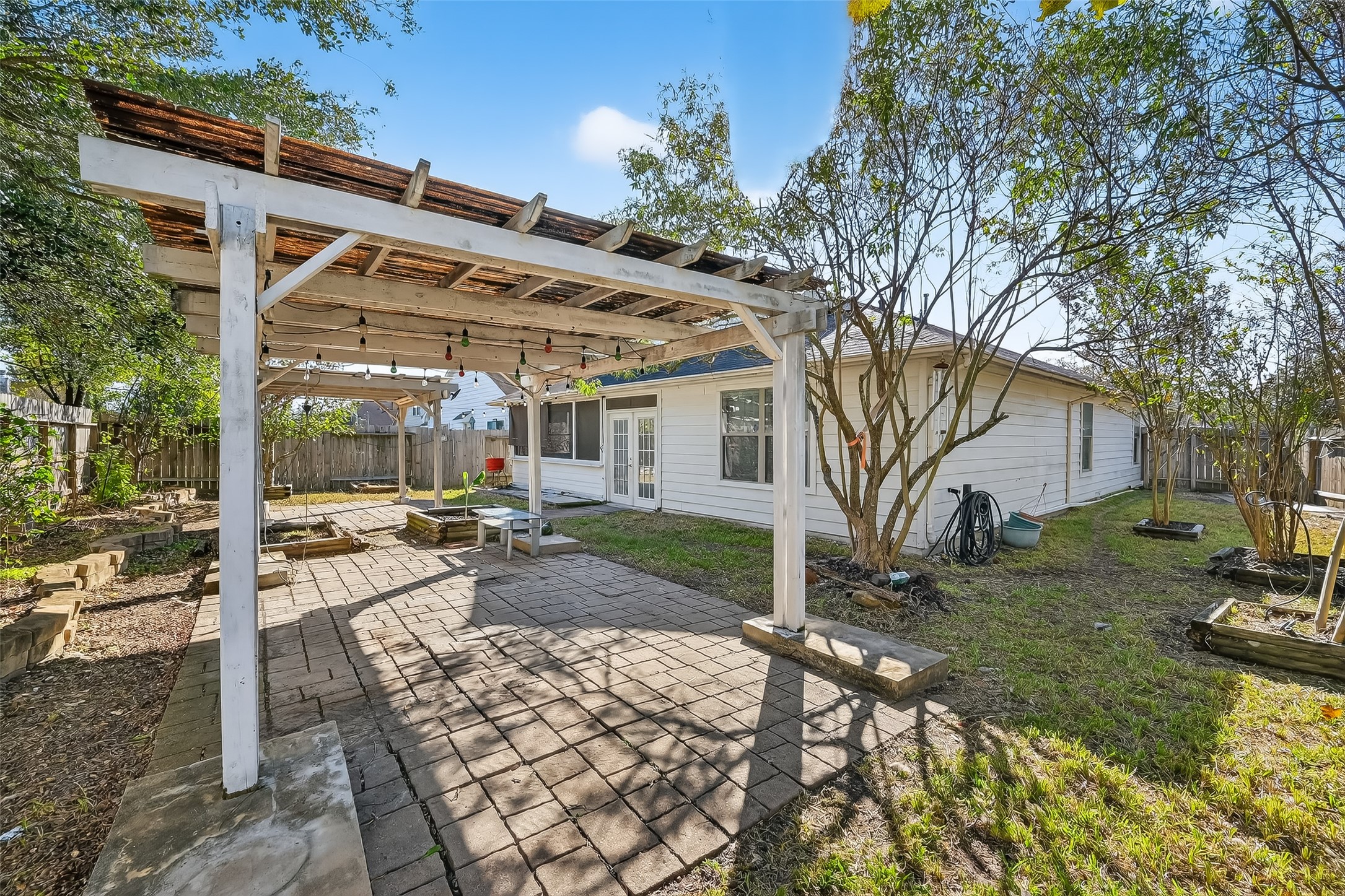 20426 Sweet Louetta Lane Spring, TX 77388 - Photo 19 of 20 a view of a backyard with a patio