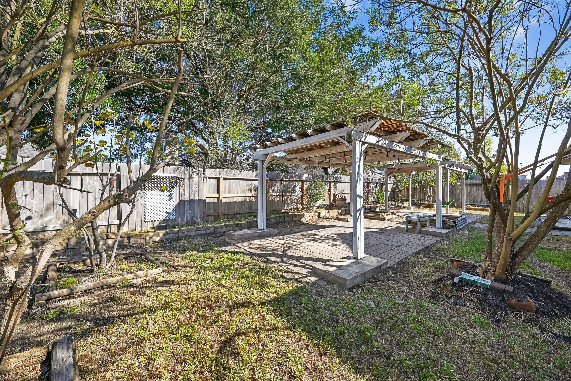 20426 Sweet Louetta Lane Spring, TX 77388 - Photo 20 of 20 a view of a patio with a table and chairs under an umbrella