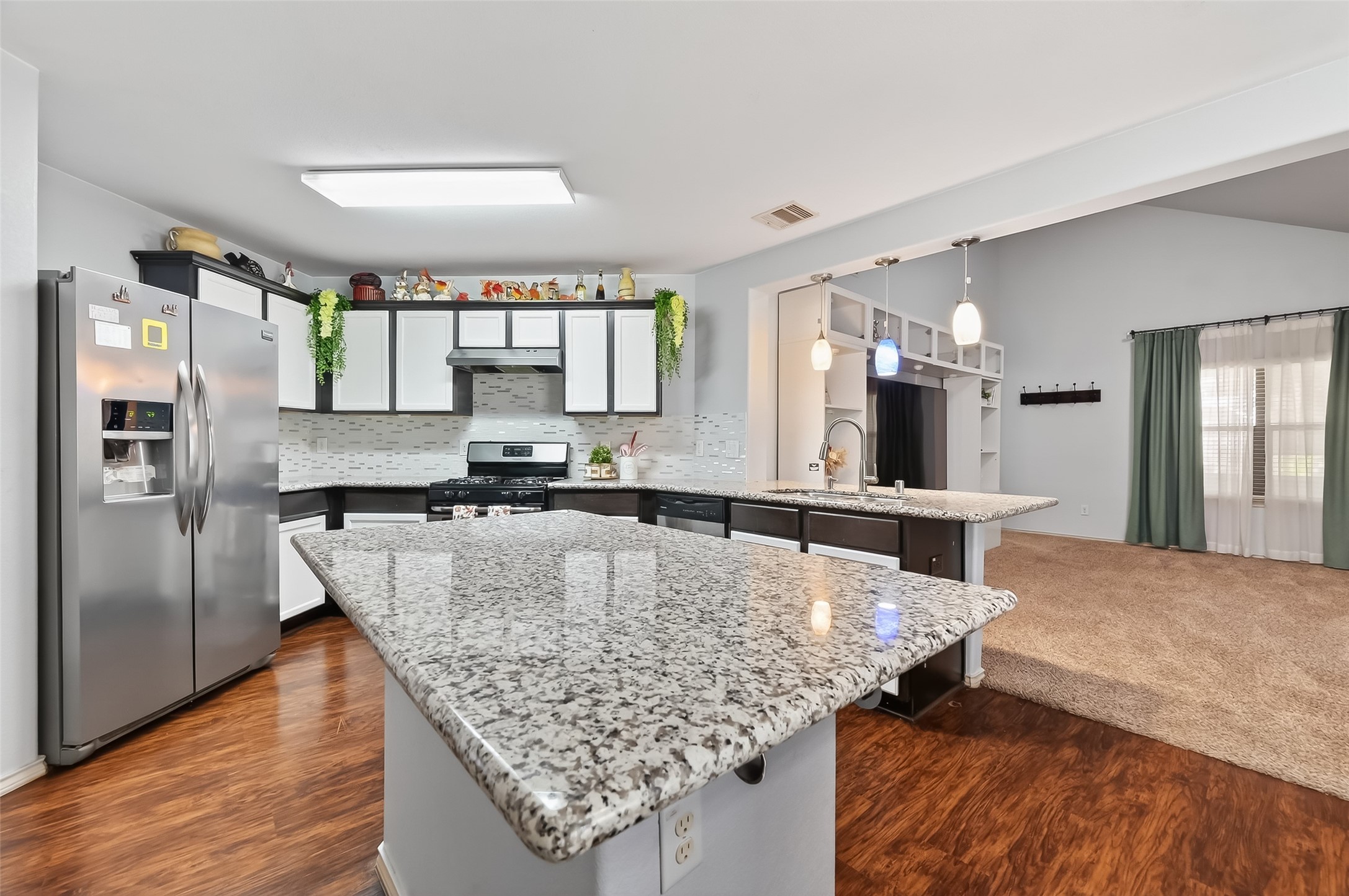 20426 Sweet Louetta Lane Spring, TX 77388 - Photo 5 of 20 a kitchen with granite countertop a stove and refrigerator