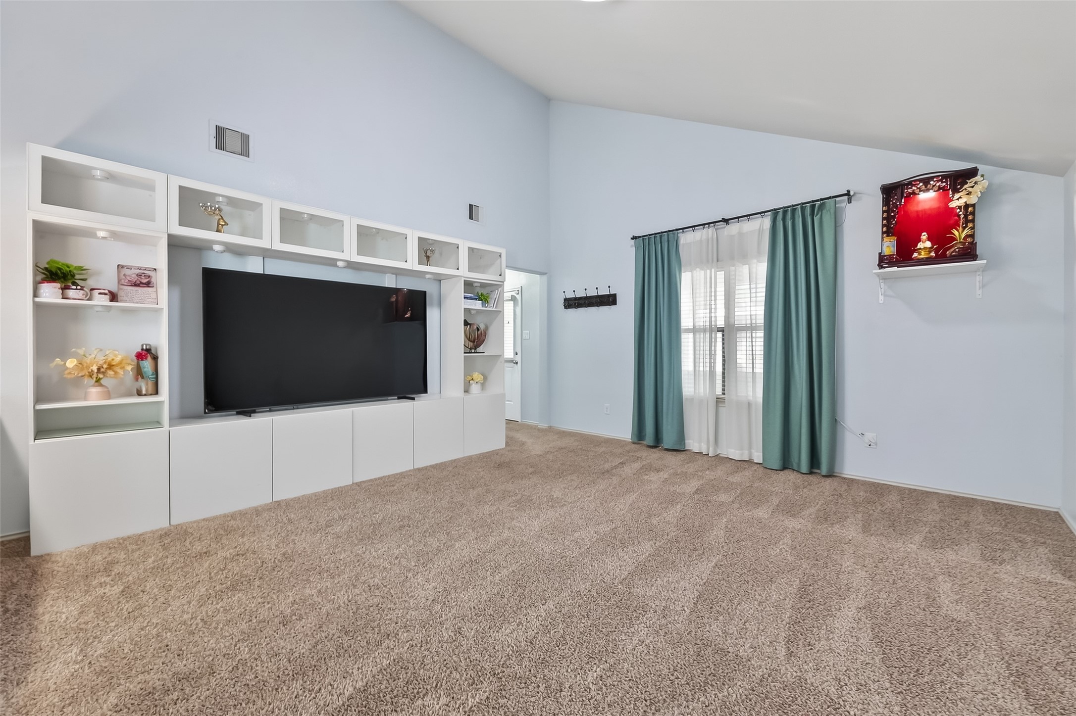 20426 Sweet Louetta Lane Spring, TX 77388 - Photo 7 of 20 a living room with furniture and a flat screen tv