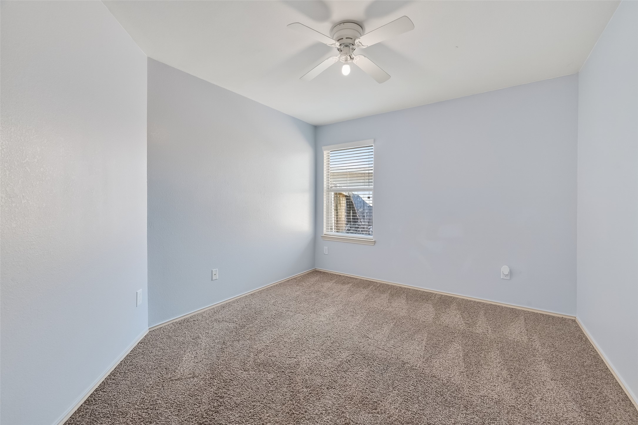 20426 Sweet Louetta Lane Spring, TX 77388 - Photo 10 of 20 an empty room with windows and fan