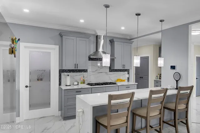 a kitchen with kitchen island granite countertop a counter space stainless steel appliances and cabinets
