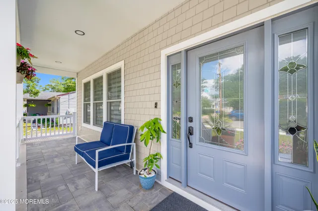 a outdoor living space with furniture and a potted plant