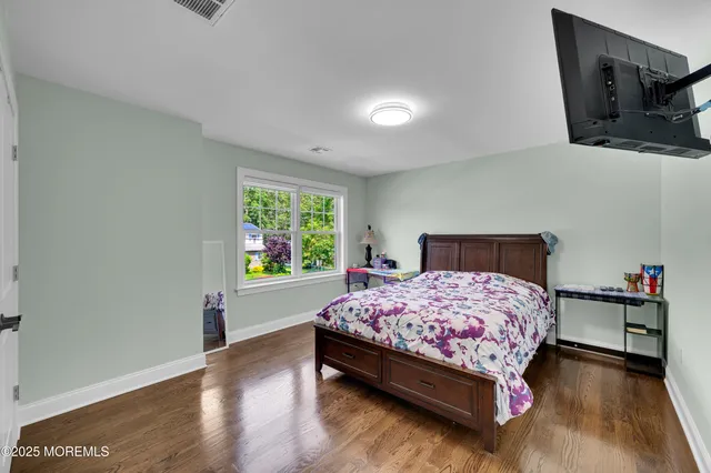 a bathroom with a double vanity sink a mirror and shower