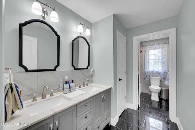 a work room with furniture and a window