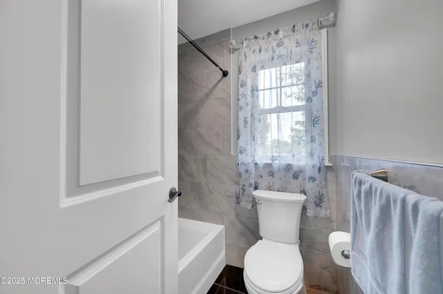 a view of a patio with a table chairs and a backyard