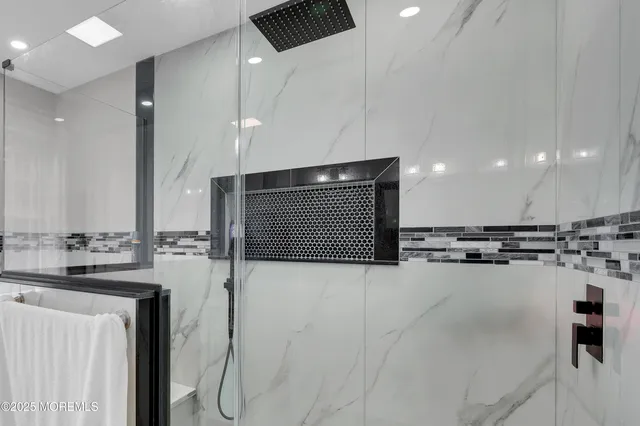 a bedroom with a bed and a desk in it