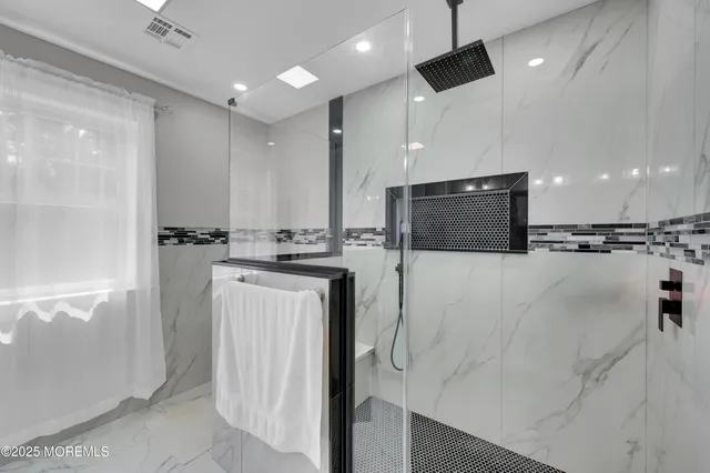 a bedroom with a bed and a lamp