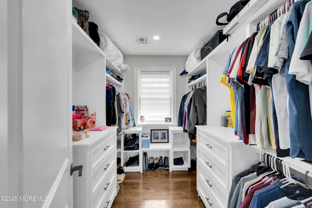 a kitchen with a refrigerator and cabinets