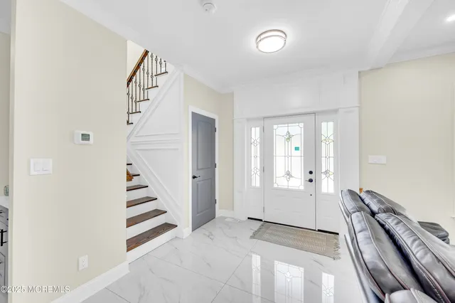 a view of a hallway with staircase