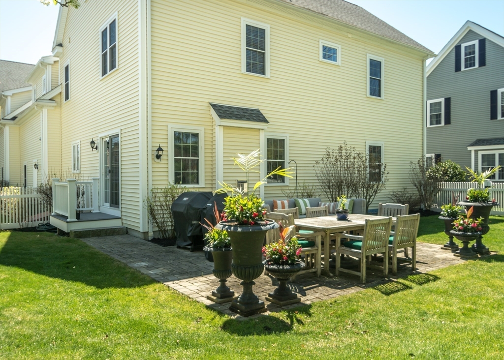 128 Church Street, Unit 2 Waltham, MA 02452 - Photo 35 of 41 a view of a backyard with sitting area and garden