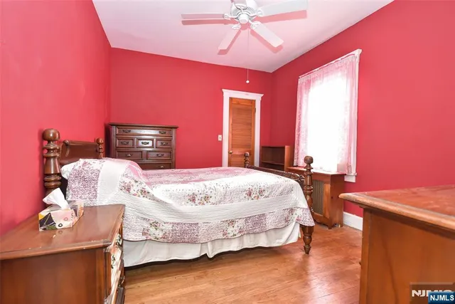 a bed room with a bed and a chandelier