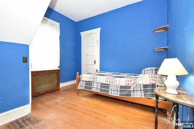 a bedroom with a bed and a table